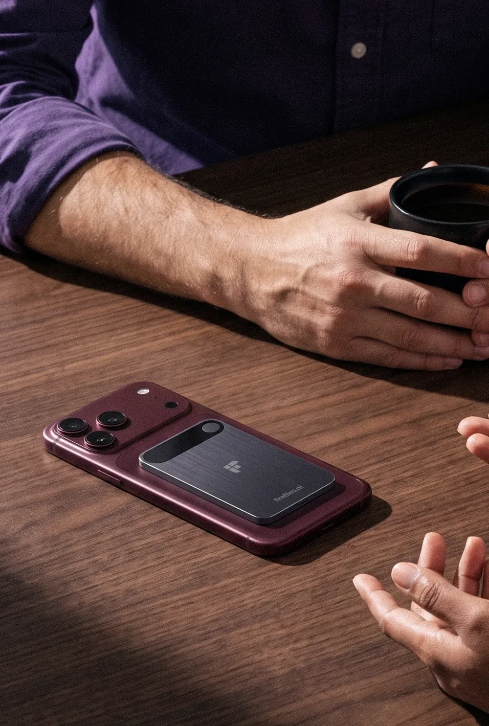 Fireflies Fly on the back of a phone, on a meeting table between two people